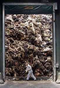 An employee works inside the Caivano dump, near Naples, southern Italy, where rubbish is turned into bales. Neapolitans took the law into their own hands after the city ran out of space to dump rubbish