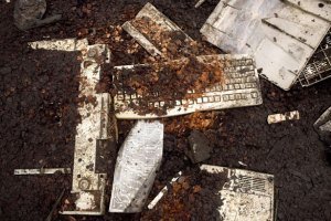 Computer parts lie on the ground at a dump in Accra, Ghana. Thousands of discarded computers from western Europe and the US arrive in the ports of west Africa every day, ending up in massive toxic dumps where children burn and pull them apart to extract metals for cash.